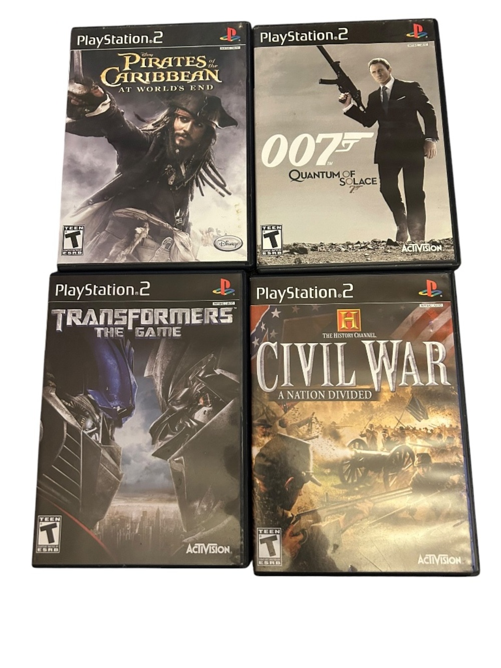 PS2 Action Game Lot (4 Titles) - 007 Quantum Solace, Transformers, Pirates CIB